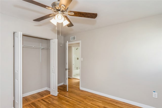 unfurnished bedroom featuring a closet, ceiling fan, and hardwood / wood-style floors