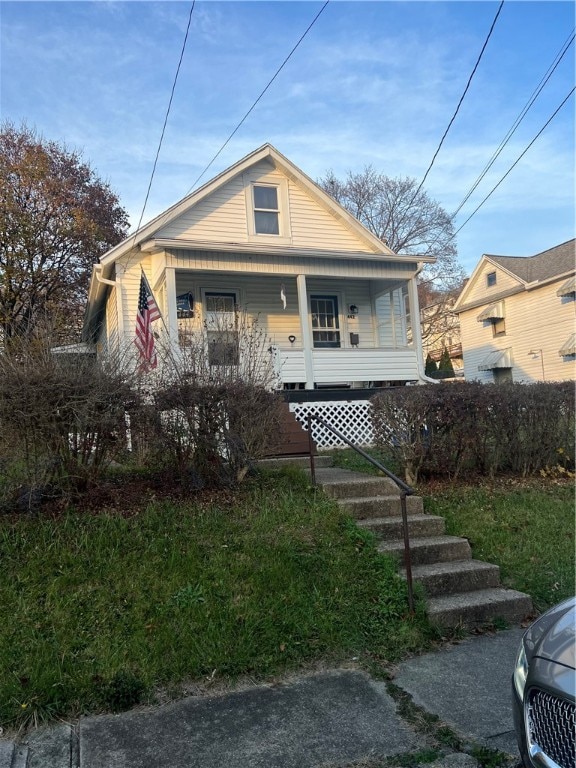 bungalow-style house featuring covered porch