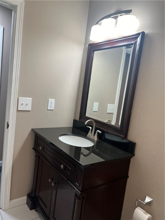 bathroom featuring tile patterned floors and vanity