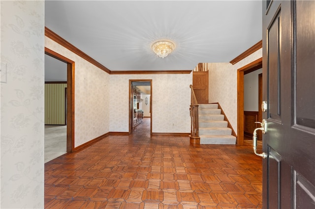 foyer featuring parquet flooring and ornamental molding