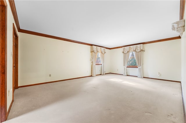 unfurnished room featuring crown molding and light carpet