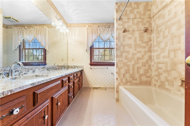 bathroom featuring tile patterned flooring and vanity