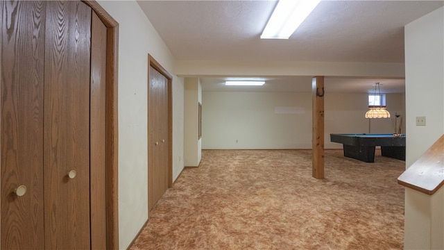 basement featuring light colored carpet and pool table