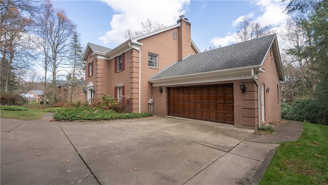 view of side of home with a garage