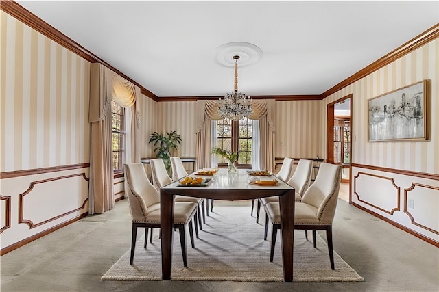 carpeted dining space with ornamental molding and a notable chandelier