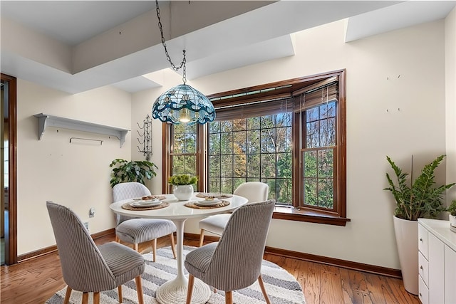 dining area featuring light wood-type flooring