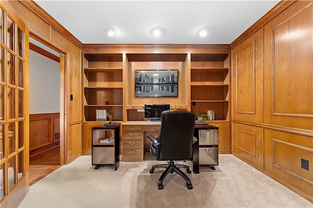 office area with built in features and light colored carpet