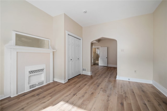 unfurnished living room with light wood-type flooring