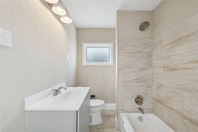 full bathroom featuring vanity, toilet, and tiled shower / bath combo