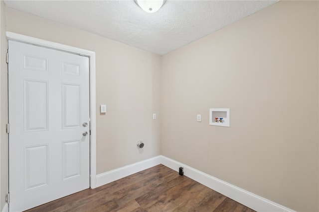 laundry room with a textured ceiling, dark wood-type flooring, and hookup for a washing machine