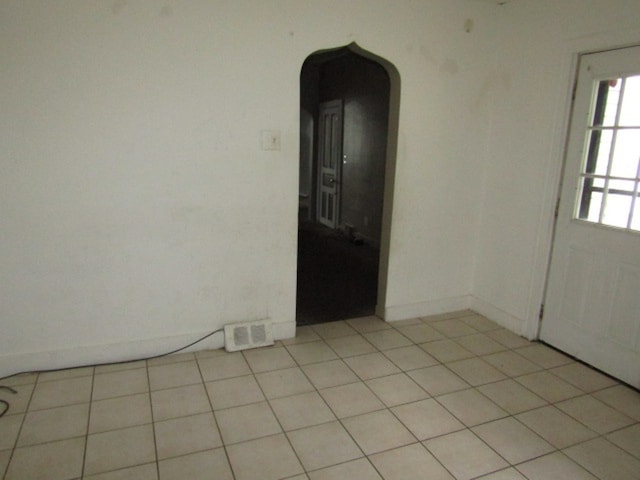 empty room with light tile patterned flooring