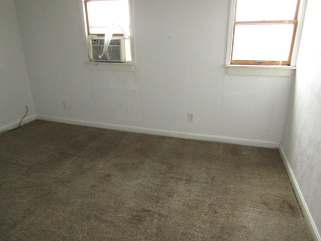 carpeted spare room with cooling unit