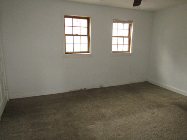 carpeted empty room with ceiling fan