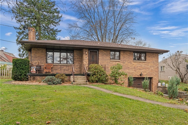 view of front facade with a front yard and a garage