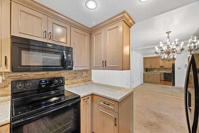 kitchen featuring light carpet, tasteful backsplash, light stone counters, black appliances, and a chandelier