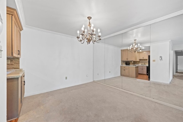 unfurnished living room featuring ornamental molding, light colored carpet, and an inviting chandelier