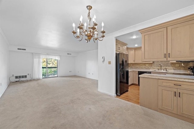 kitchen with light brown cabinets, ornamental molding, stainless steel refrigerator with ice dispenser, and light carpet