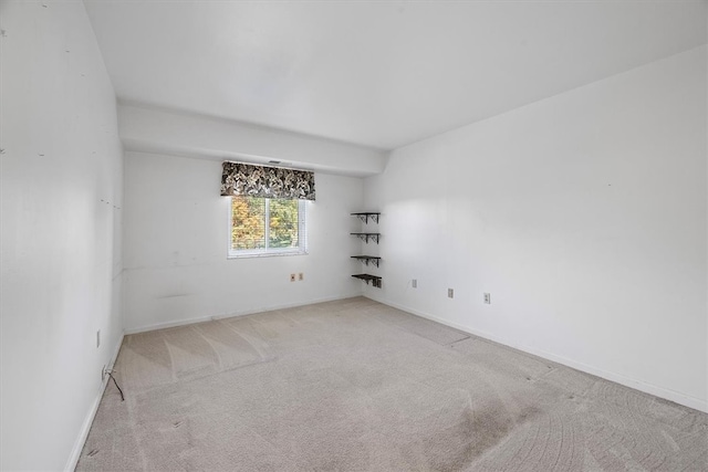 empty room with light colored carpet