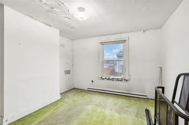 empty room with carpet flooring and a baseboard radiator