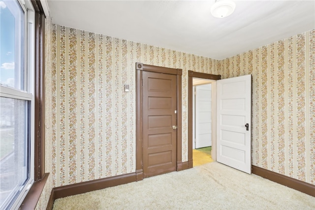 unfurnished bedroom with carpet flooring