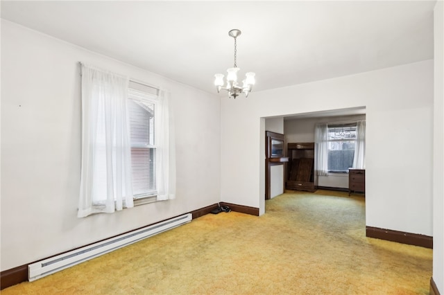 carpeted empty room with a chandelier and a baseboard radiator