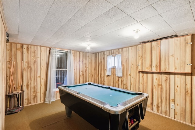 game room featuring light carpet, wooden walls, and pool table