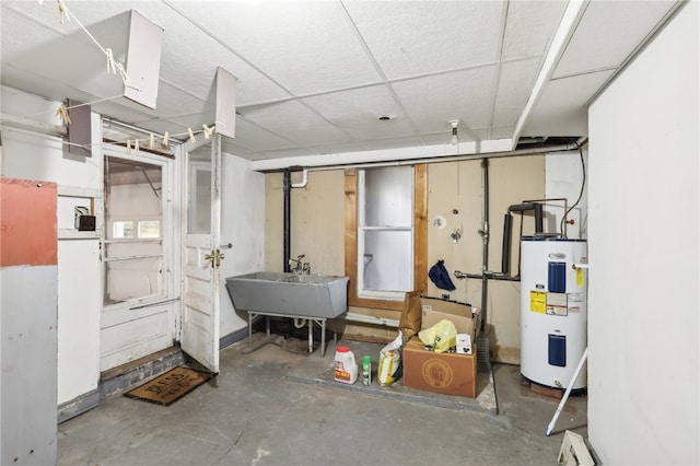 basement featuring sink and water heater