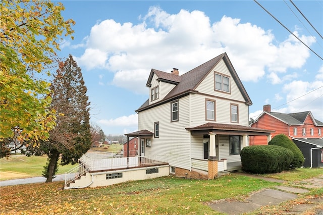 view of side of home with a lawn