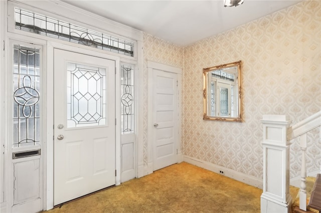 view of carpeted foyer