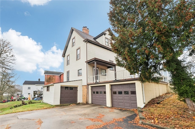 view of side of property featuring a garage