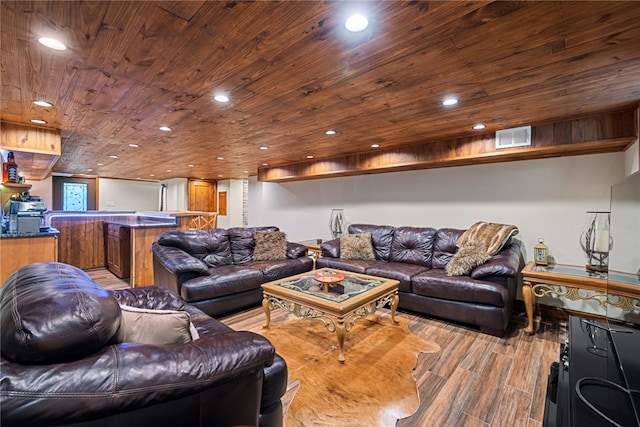 living room featuring light hardwood / wood-style flooring and wooden ceiling