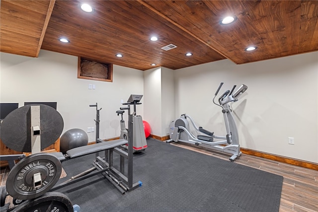 workout room with hardwood / wood-style flooring and wood ceiling