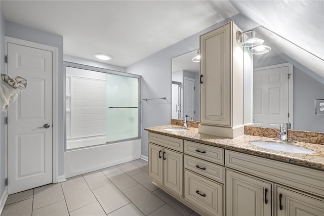 bathroom featuring shower / bath combination with glass door, vanity, and tile patterned flooring