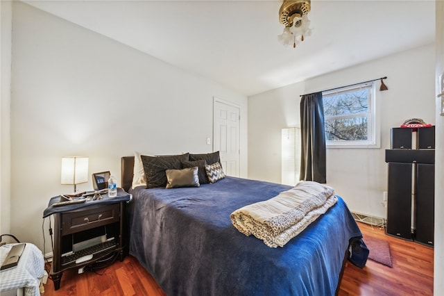 bedroom with hardwood / wood-style floors