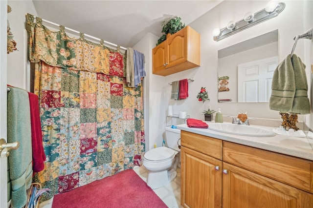 bathroom featuring tile patterned flooring, vanity, curtained shower, and toilet