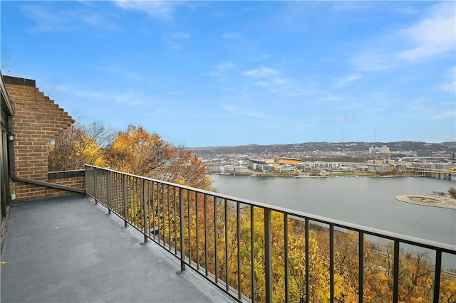 balcony featuring a water view