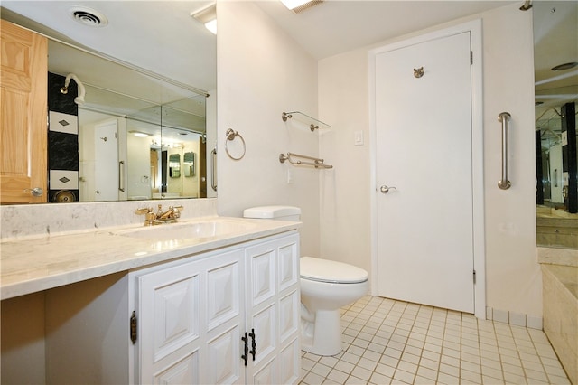 bathroom with tile patterned floors, vanity, and toilet