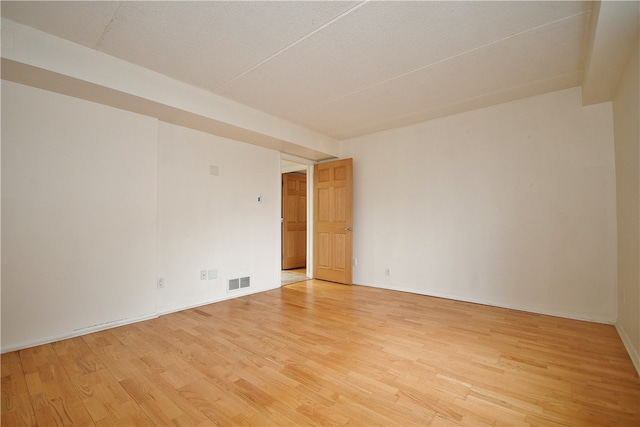 unfurnished room featuring light hardwood / wood-style flooring