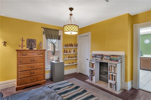 bedroom featuring dark hardwood / wood-style flooring