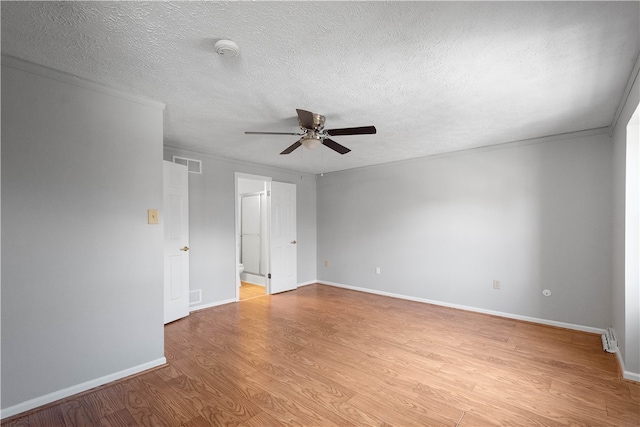 unfurnished room featuring ceiling fan, a textured ceiling, and light wood-type flooring