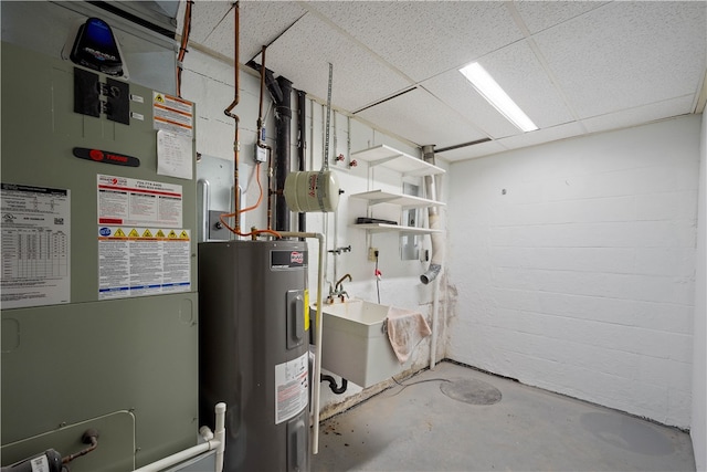 utility room featuring electric water heater, sink, and heating unit