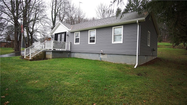 back of house featuring a yard