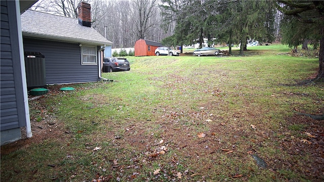 view of yard with central air condition unit