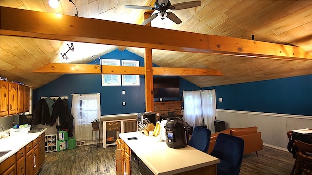 kitchen featuring wood ceiling, ceiling fan, lofted ceiling with beams, a center island, and dark hardwood / wood-style floors