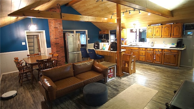 living room with track lighting, sink, hardwood / wood-style flooring, wooden ceiling, and vaulted ceiling with beams