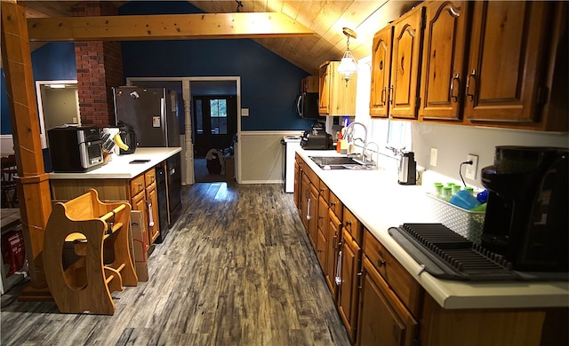 kitchen with appliances with stainless steel finishes, wood ceiling, decorative light fixtures, vaulted ceiling with beams, and dark hardwood / wood-style floors