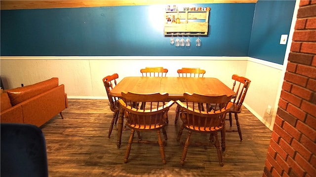 dining area with dark hardwood / wood-style flooring