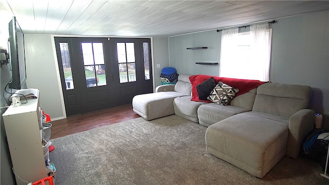 living room featuring hardwood / wood-style flooring, plenty of natural light, wood ceiling, and lofted ceiling