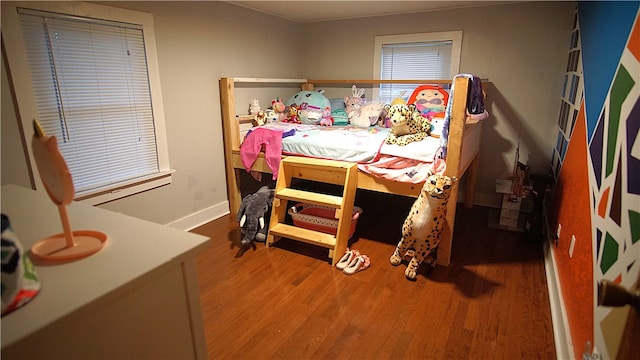 bedroom with hardwood / wood-style flooring