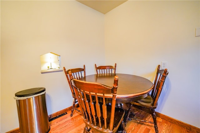 dining area featuring wood-type flooring